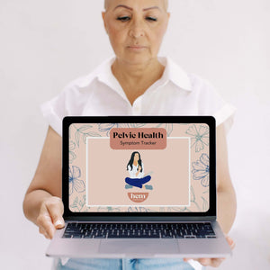 Woman holding laptop with Hem's Pelvic Health Symptom Tracker—supporting informed, personalized care at every stage.